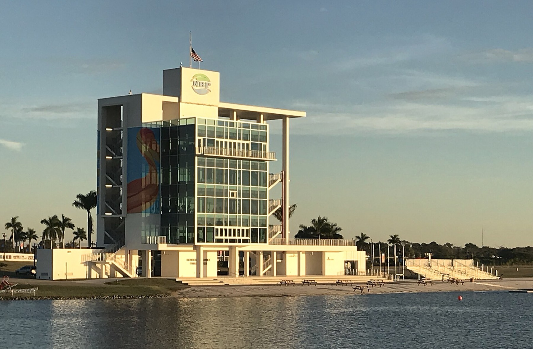 Nathan Benderson Park finish tower beside the rowing lake at golden hour with palm trees